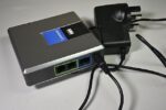 ATA adapter box with two phone (user) outputs with its power adapter.