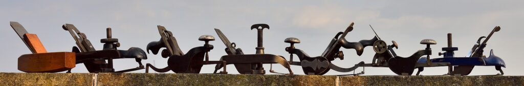 Row of compass planes in silhouette